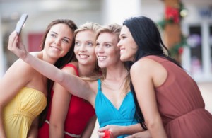 Women taking picture together outdoors